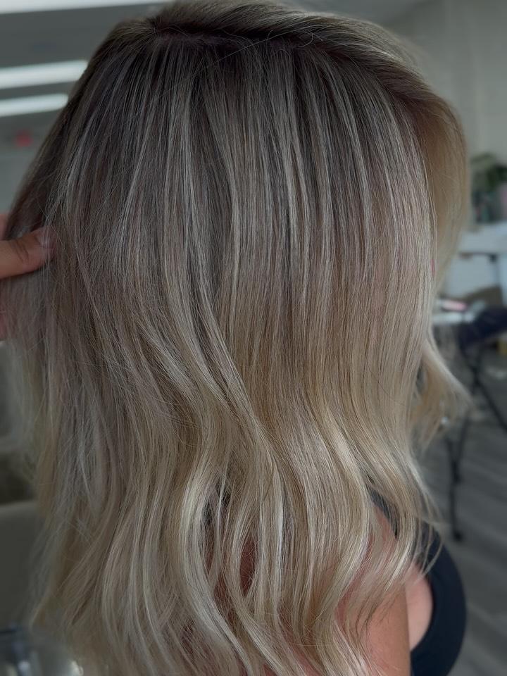 Cool-toned ash blonde balayage seen from behind